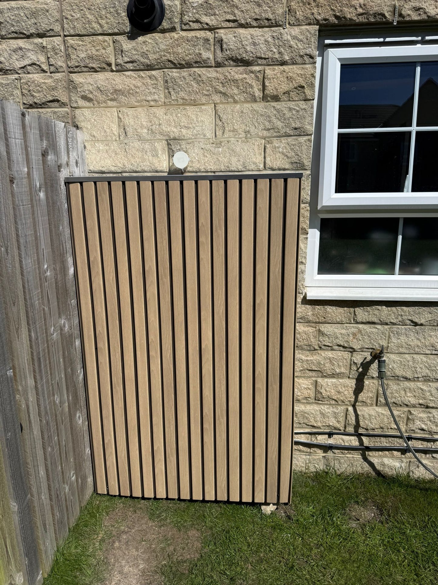 Tesla Powerwall solar battery cover in Oak finish — installed and fitted — SolarBatteryCovers.ie